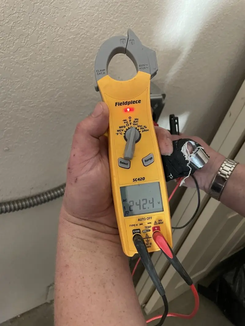Voltage testing with clamp meter during Outlet Installation in West Bridgewater